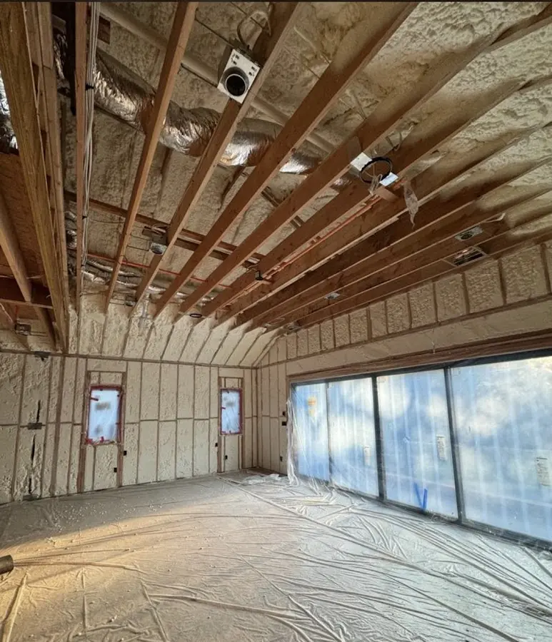 Interior walls and ceiling insulated with spray foam during new construction in Deerpark
